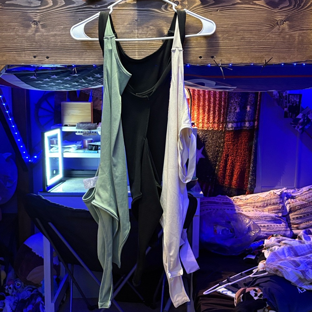 Black, white, green body suits